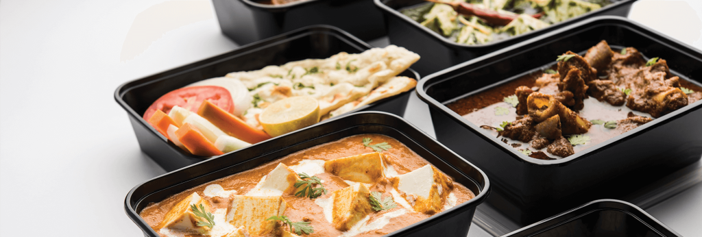 food in black trays