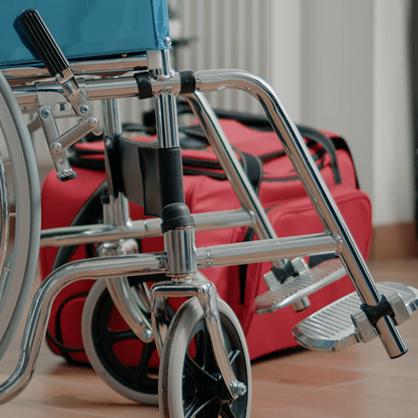 medical wheelchair with red bag